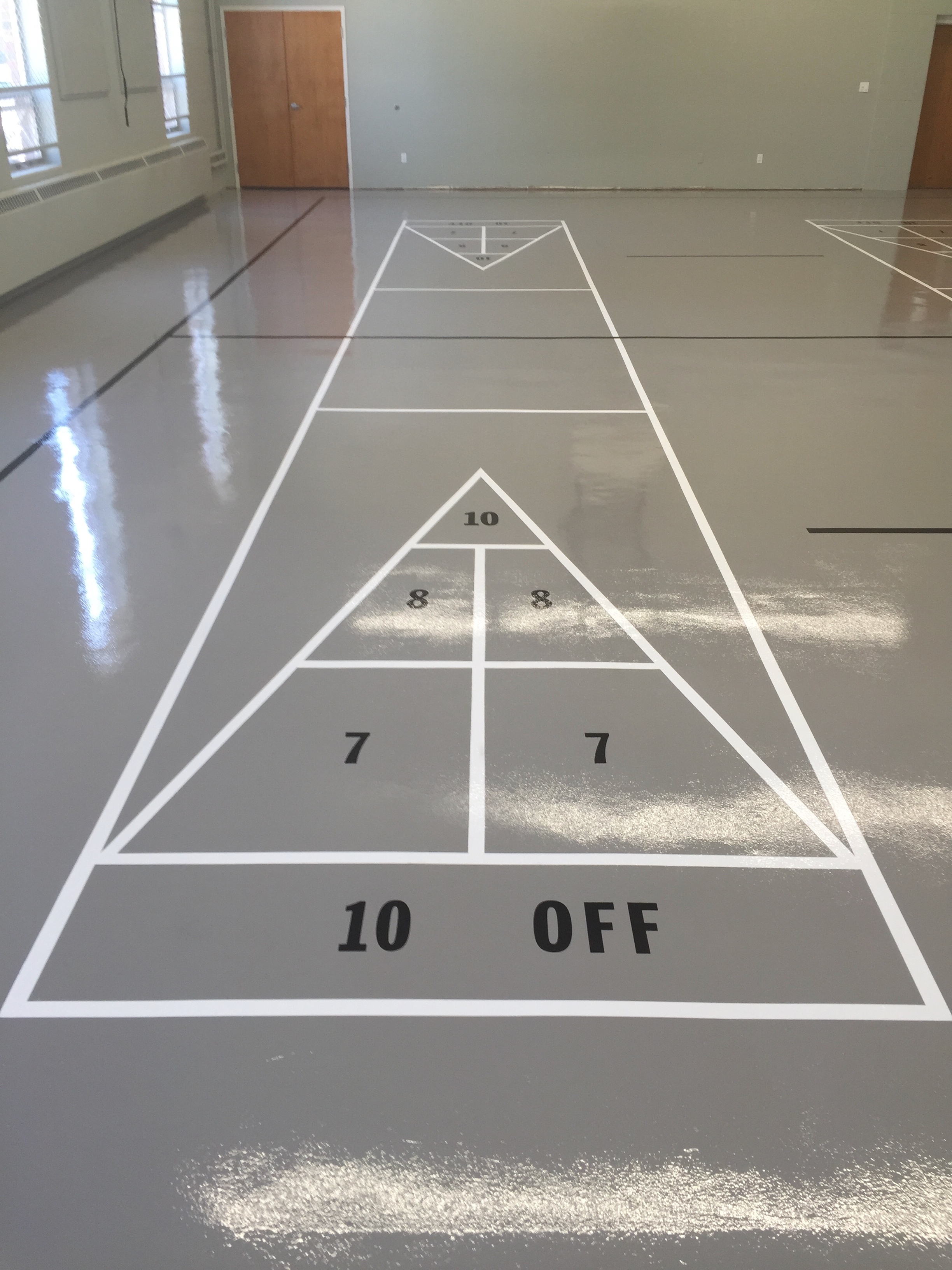  Concrete floor in church gym epoxy coated with shuffle board design